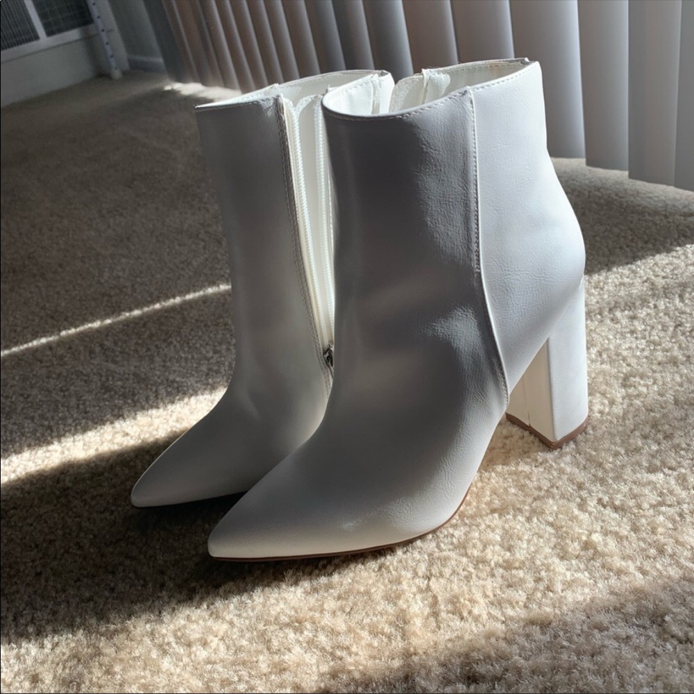 Cute white booties from JustFab’s Hannah Godwin getaway collection.